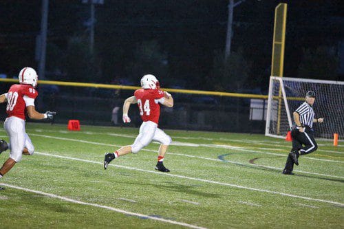 MAKE ROOM for Hickey. Melrose senior captain Jack Hickey had best performance of his high school career with 4 touchdowns in the Melrose Red Raider's home opening win against Winchester, 39-21. (Donna Larsson photo) 
