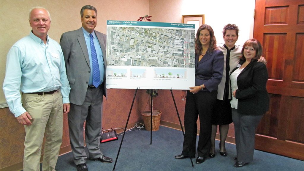 TOWN Administrator Stephen P. Maio, second from left, spoke on the revitalization of downtown Wakefield at yesterday morning’s Wakefield Lynnfield Chamber of Commerce Breakfast Before Work meeting at The Savings Bank on Main Street. From left: New Sign Compliance Officer Robert Sardella, Maio, Chamber Executive Director Marianne Cohen and Chamber Co-Presidents Suzanne Bowering and Cheryl Carroll. (Gail Lowe Photo)
