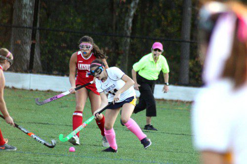 LAUREN GUERRA (14) digs the ball out to push past an Amesbury opponent Friday. The Pioneers won their 14th game of the season 6-1. (Maureen Doherty Photo)