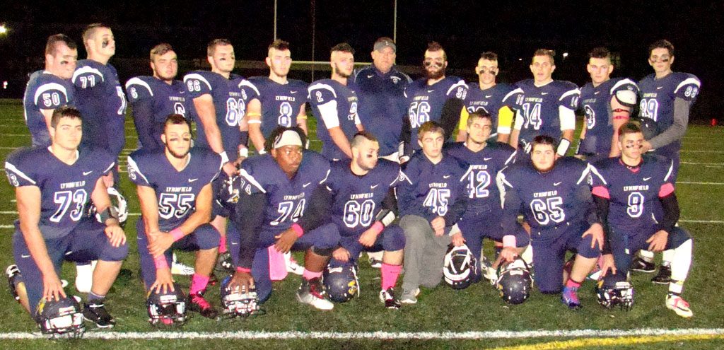 SENIOR NIGHT. The seniors enjoyed celebrating with their friends and parents before the game with Ipswich. Now it's on to the playoffs for the 7-0 Pioneers. Front row (from left) Brandon Troisi (73), Steve Kinnon (55), Edison McIntosh (74), Matt Albano (60), Lucas Pascucci (45), Kevin Lee (42), Dylan Shaffer (65) and Marc Budd (9). Back row (from left) Nick Wilkinson (50), Steven White (77), Jake Rourke (6), Al MacLachlan (66), Captain Cam Rondeau (8), Captain Danny Sullivan (2), Head Coach Neal Weidman, Captain David Adams (56), Captain Jon Knee (10), Chad Martin (14), Rob Debonis (3) and Chris O’Neill (89). (Tom Condardo Photo)