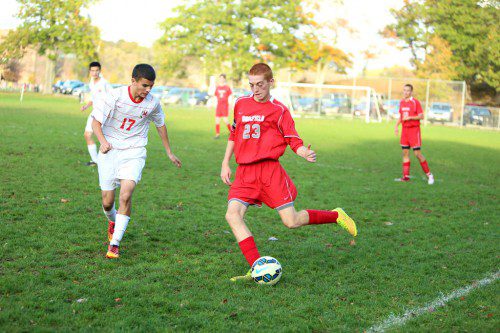 IAN RITCHIE, a senior (#23), scored one of the five Warrior goals as the WMHS boys’ soccer team posted a decisive 5-2 triumph over Melrose yesterday afternoon at West Knoll Field. (Donna Larsson Photo)