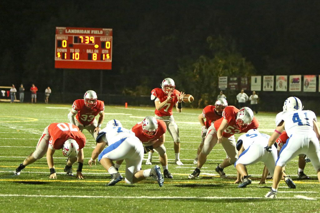 QB ANTHONY Cecere (#7) takes the snap from center during Friday night’s game against Stoneham. Wakefield posted a 27-0 triumph at Landrigan Field and the Warriors hope to earn their third straight win when they host Burlington tomorrow night. (Donna Larsson File Photo)