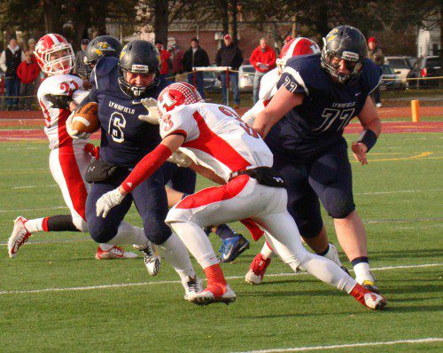 JAKE ROURKE (6) powers through the Panthers defense as Steven White (77) leads the blocking. (Tom Condardo Photo)