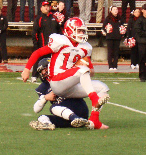 TREVOR CASWELL (53) sacks Holliston QB Nick Athy for a seven-yard loss in the first half of Saturday's state semifinals. (Tom Condardo Photo)