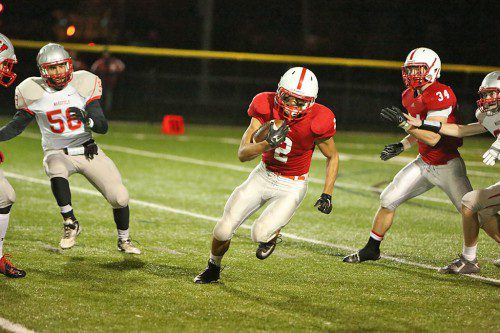 MELROSE SENIOR Christian Pizzotti came up big for the Red Raider Football team, who shutout rival Wakefield in the opening round of the Div. 3 Northwest playoffs, 24-0 last Friday night. Melrose now travels to Woburn to take on the undefeated Tanners this Friday night at 7:00 p.m. (Donna Larsson photo)