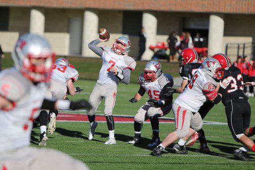 SENIOR QB Anthony Cecere (#7) drops back to pass as Matt Mecurio (#53), Joe DiFazio (#45), and Alex Kane (#69) block up front. (Donna Larsson photo)