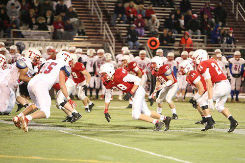 NOBODY WAS getting past Melrose's line during the Red Raider's 14-7 upset victory over defending state champion Tewksbury at the State Semifinals Saturday, which earned Melrose its first trip to Superbowl in 32 years. Not with Raiders Cam Hickey (88), Jack Hickey (34), Brian McLaughlin (19) Ryan Feeney (38) and Zack Mercer (24) on the job. (Donna Larsson photo)