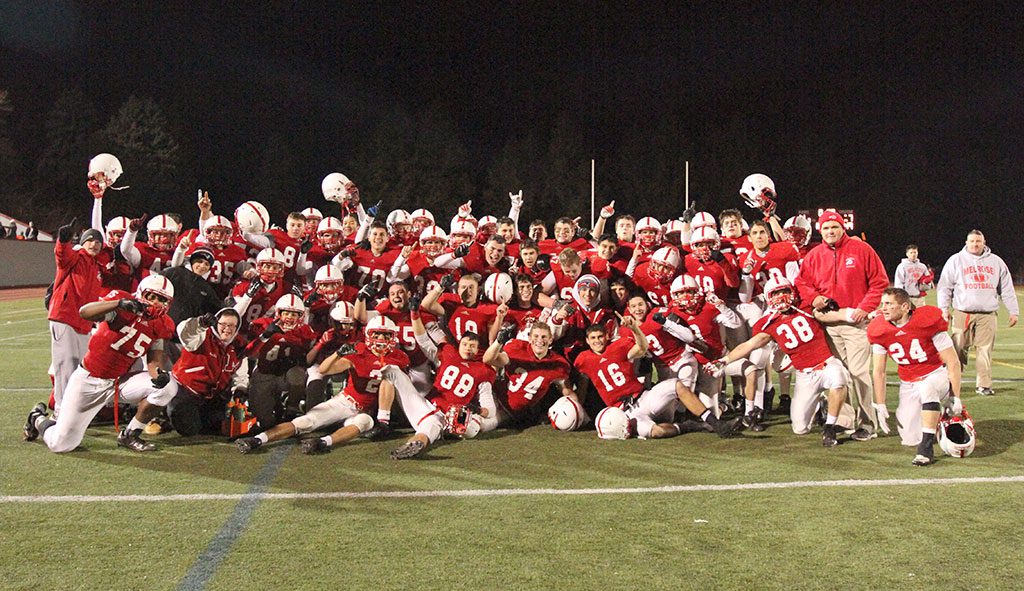 FOR THE first time in 32 years the Melrose Red Raider football team is going to the Superbowl. Melrose upset defending state champ Tewksbury 14-7 on Saturday at the Div. 3 North finals to punch their ticket to Gillette Stadium on Dec. 6 in Foxboro. Pictured is the 2014 Melrose champs celebrating their historic win. (Donna Larsson photo)