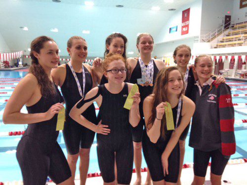MEMBERS OF the Melrose High School girls swim team celebrate their record-breaking performance at State Finals (courtesy photo)