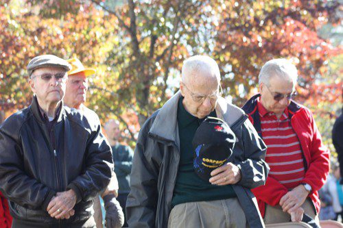 THE SACRIFICES of veterans, both living and dead, were honored by those attending the town's Veterans’ Day ceremony including (from left) Charles Porter, U.S. Navy Korean War veteran, 1952-56; Paul Anderson, a medical corpsman surgical assistant who served in the U.S. Navy with the Marines during Korean War, 1951-55; and Gene Gangemi, Army Reservist from 1966-72 during Vietnam War. At rear is Ed Purtz, WWII Army Air Corps, 320th Bomb Group, 1942-45. (Maureen Doherty Photo)