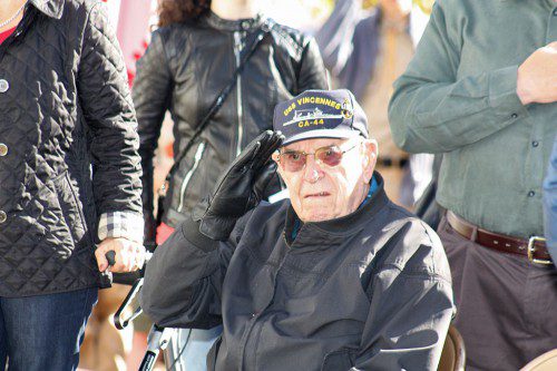 WWII U.S. NAVY veteran Earl Richard salutes as Taps was played during the town's Veterans' Day ceremony Tuesday. Richard, who served from 1940-46, is a proud survivor of the sinking of the USS Vincennes CA-44 in the Battle of Savo Island at Guadalcanal on Aug. 9, 1942. He swam to a life raft where he spent the night in shark infested waters while holding up a badly injured crewman until they were rescued five hours later by the USS Mugford of Marblehead.      (Maureen Doherty Photo)