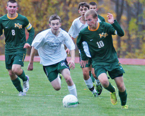SENIOR ADAM SAPP, (10), found the net to open scoring for North Reading, which went on to beat Pentucket and finish second in the Cape Ann League with a 12–3–3 record. Number 8 for the Hornets is Alex Brown. (John Intorcio Photo)