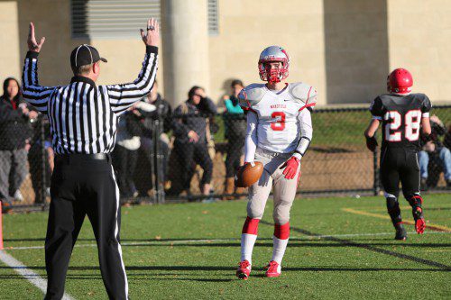 SENIOR WR Brian Dickey (#3) caught a 19 yard pass for Wakefield’s first score of the Winchester game as the official signals a touchdown. The Warriors are hoping for a winning result when they host Burlington tomorrow night at Landrigan Field. (Donna Larsson File Photo)