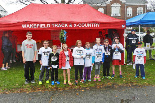 THE RUNNERS who competed in the Frozen Frolic Mile Kids’ Fun Run received ribbons for participating in the event. The top three finishers also received medals. (Colleen Riley Photo)