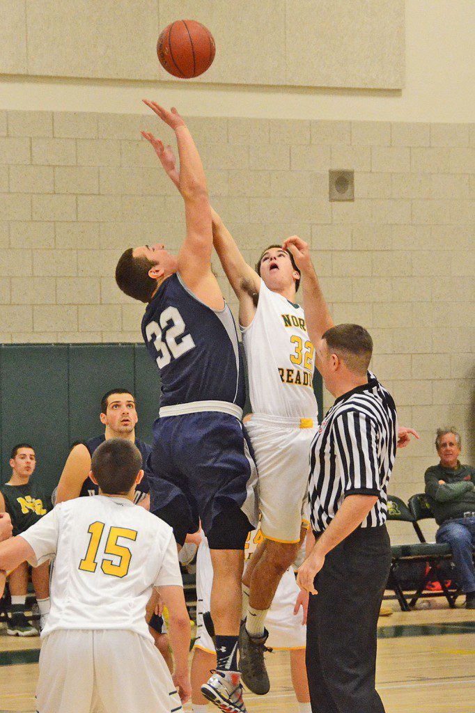 SENIOR TOM LEWIS battles for the opening tip off against Hamilton–Wenham. (John Friberg Photo)