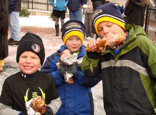 MY THREE SONS. Head Coach Neal Weidman’s three boys, from left: Tripp, Cal and Hudson Weidman, enjoy post-game turkey legs to celebrate their dad’s Thanksgiving Day victory over North Reading. (Tom Condardo Photo)