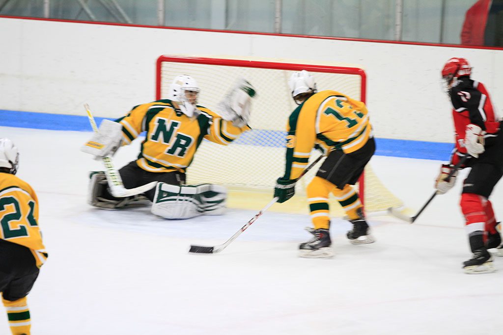 HORNET JUNIOR GOALIE Nick Ponte makes another great save in North Reading's win over Amesbury. No. 13 for the Hornets is Jared Valade. (Stephanie Tannian Photo)