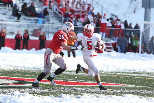 MIKE PEDRINI'S third quarter touchdown helped spirit a Melrose comeback that led to their 15-14 victory over Wakefield at the 55th Annual Thanksgiving Classic held in Wakefield last Friday. (Donna Larsson photo) 