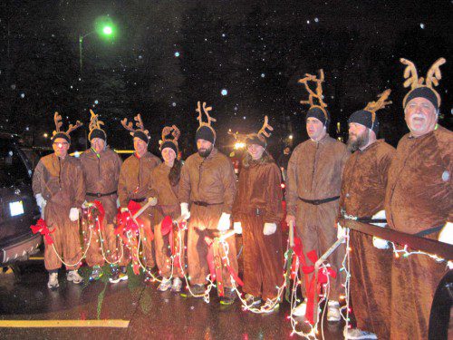 SANTA CLAUS and his reindeer delighted 43 children in Wakefield Tuesday night when they delivered toys and other gifts during the annual Sleigh Pull. (Gail Lowe Photo) 