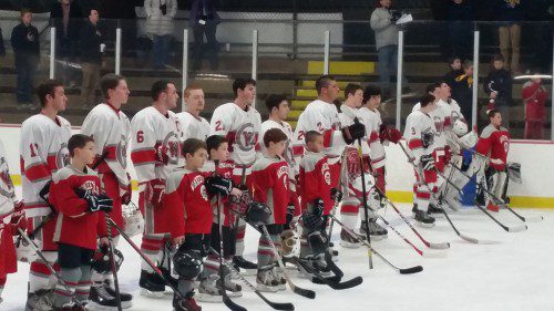 MEMBERS OF the WYSA Squirt 3 hockey team were honorary captains for the Wakefield Memorial High boys’ hockey team’s season opener against Lexington on Wednesday, Dec. 17. The Squirt 3 players are Alex Dubow (#74), Matt Barbera (#25), Zach Laverdure (#1), Ryan Sallee (#4), Zack Gori (#28) and goalie Josh Poires (#40).