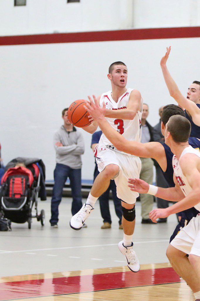 SENIOR GUARD Brian Dickey scored a game high 19 points and was named to the All-Tournament team for his effort. However, the Warrior boys’ basketball team dropped a 63-57 game to Arlington Catholic in the consolation round of the Golden Tornado Holiday Tournament last night at Malden High School. (Donna Larsson File Photo)
