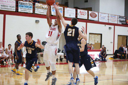SENIOR GUARD Chris Calnan (#11) scored a game high 23 points, had seven assists and three steals in Wakefield’s 73-52 victory over Reading last night at the Charbonneau Field House. (Donna Larsson File Photo)