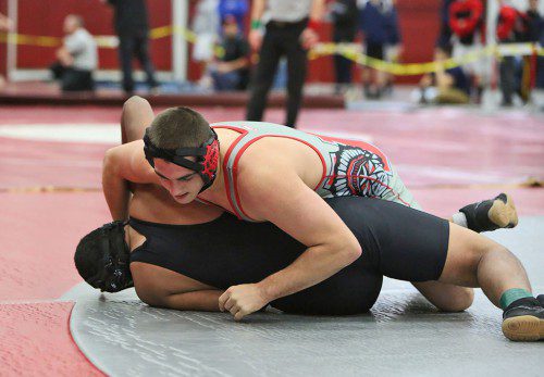 DAN WENSLEY, a senior tri-captain (top), repeated as the champion at the 195 weight class in the Anthony Lisitano Memorial Tournament which was held Saturday at the Charbonneau Field House. (Donna Larsson Photo)