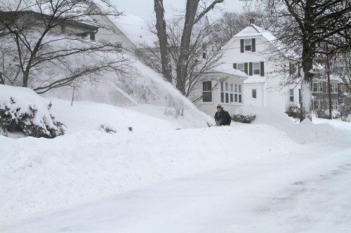 DIGGING OUT FROM OVER two feet of snow is never easy, especially when it is whipped up by high northeasterly winds. On Tuesday, the cleanup gets underway at this West Highland Avenue home. (Donna Larsson Photo)