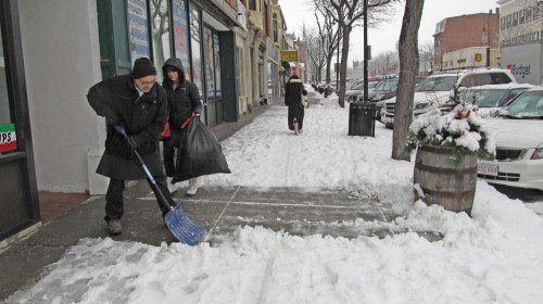A STORM that swept through the region on Saturday left about four inches of snow. Ralph Caira, owner of The Italian Kitchen of Wakefield on Main Street, was spotted shoveling the sidewalk in front of his store. Forecasters are saying the region will get up to 24 more inches from a nor’easter expected to blast through the area later today and tomorrow. (Gail Lowe Photo)