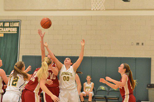 WAIT FOR IT...Senior forward Frankie Elliott waits for the rebound to come to her in the girls season opener against Newburyport, a Hornet victory. (Bob Turosz Photo)