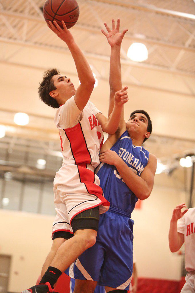 JULIAN NYLAND drives to the net for the Melrose Red Raider basketball team, who went 3-1 in league action last week. (Donna Larsson photo)