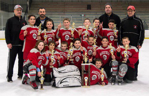 THE SQUIRT 2 hockey team won the Winter Classic Tournament. In the front row is Donovan Foley. In the second row (L to R) are Caroline Melanson, Marcus Guida, Drew Barrett, John D’Alessandro, Zack Sartori, Brendan Campea and John Jenkins. In the third row (L to R) are Joe Carangelo, Alex Fata, Leo Yardumian, Matt Conley, Jacob Dubuque and Sean Doherty. In the back row (L to R) are Coach Don Dubuque, Coach Steve Fata, Coach Paul Carangelo and Coach Robert Guida.
