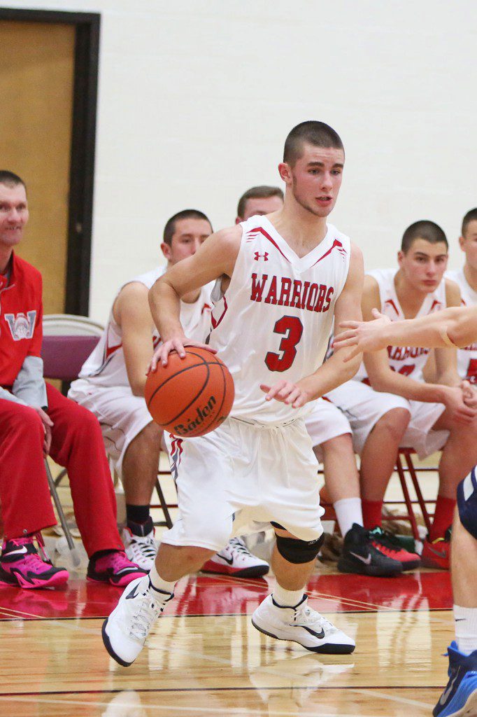 BRIAN DICKEY, a senior captain, netted a team high 21 points and scored what turned out to be the game-winning basket last night in Wakefield’s 62-59 win over Melrose at the Charbonneau Field House. Dickey also had five assists as well to help lead the Warriors. (Donna Larsson File Photo)