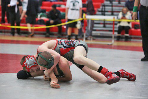 JACK SPICER, a sophomore (right), won by pin at the 106 weight class in Wakefield’s dual meet against Lynnfield/North Reading. Spicer defeated Will Grover at 4:35, but the Warriors lost the meet on Wednesday night at the Charbonneau Field House. (Donna Larsson File Photo)