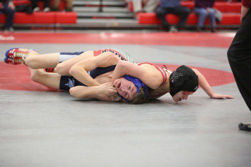 SHANNON DRAGER, a junior (right), earned a win by a 4-3 decision at the 113 weight class against Triton’s Anthony Ausragiers. Wakefield came up short in the meet against Vikings as it lost by a 40-30 score last night at the Charbonneau Field House. (Donna Larsson Photo)