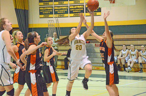 SENIOR GUARD Adrianna Flanagan drives the lane against Ipswich. North Reading beat the Tigers, 57 to 48. (John Friberg Photo)
