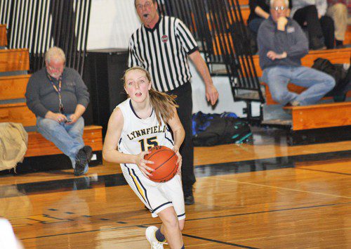 FLOOR CAPTAIN. Abby Weaver demonstrates her command of the floor running the point. She scored four points and added five assists in Lynnfield's 49-31 win over Amesbury. (Maureen Doherty Photo)