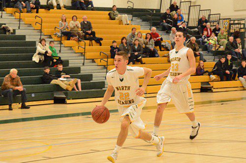 BRANDANO SCORES. Senior Tri–Captain Shane Bartlett scores on this breakaway to give the Hornets much needed momentum in in their game against Newburport. Right behind Bartlett is senior Derek Hogan. (Deanna Castro Photo)