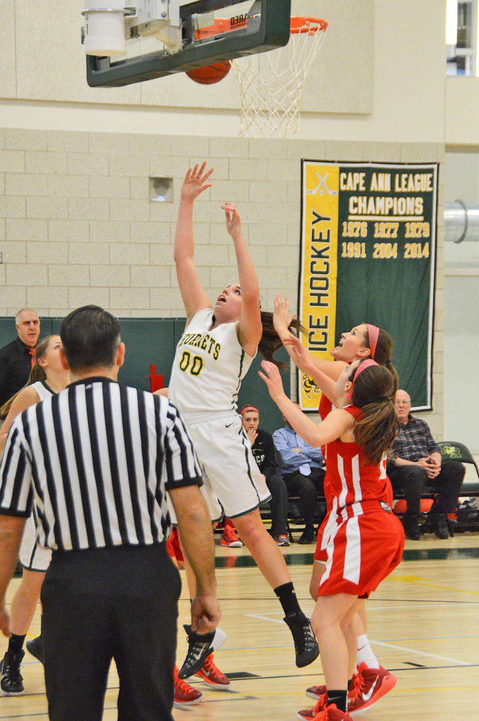 SENIOR FRANKIE ELLIOTT goes up for two hard earned points to give North Reading a lead against Masco. (John Friberg Photo)