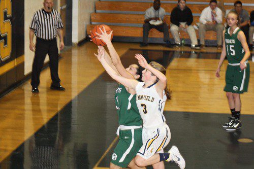 PIONEER Katie Scanlon (3) aggressively attempts to steal the ball fro her Hornet opponent late in Friday's game. Both teams traded the lead and knotted the score multiple times before Lynnfield pulled away for good with a 48-42 win. The Pioneers improved to 5-5 in the CAL and 8-6 overall. (Maureen Doherty Photo)