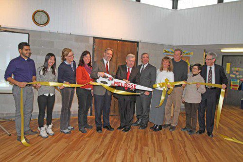 ATTENDING THE March 5 ribbon cutting ceremony at the First Congregational Church were (left to right): Ani Krishnan, MAPC; Kimberly Le, EnergySage; Martha Grover, Melrose energy efficiency manager; Nancy Brincheiro, Senior Deacon, FCC; Rev. Dominic Taranowski; Mayor Rob Dolan; Ward 6 Alderman Peter Mortimer; Lori Timmermann, Melrose solar coach; Bob Clarke, 621 Energy; Lisa Oosterman, capital campaign committee co-chair; and Jim Oosterman (capital campaign committee co-chair).