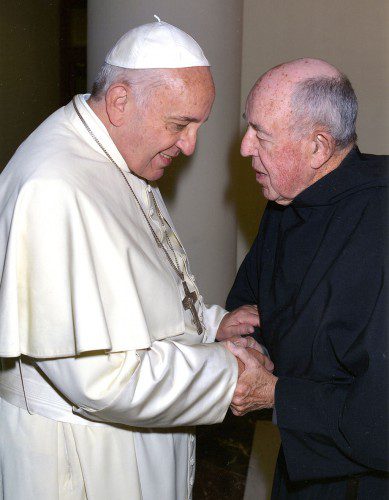 POPE FRANCIS and Rev. James Wenzel, OSA, talk following a concelebrated Mass at the Casa Santa Martha Chapel in the Vatican last fall, a highlight of the Wakefield native’s career of nearly 65 years with the Order of St. Augustine.