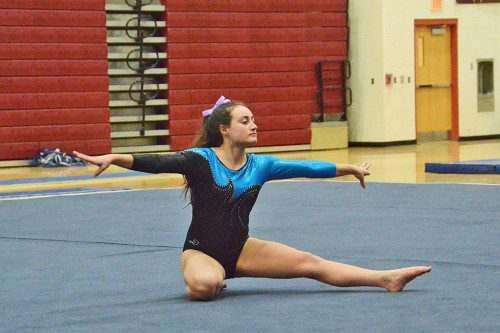 HORNET FRESHMAN Rachel Hill performs in the floor exercise at the MIAA state gymnastics tournament in Northborough. (John Friberg Photo)