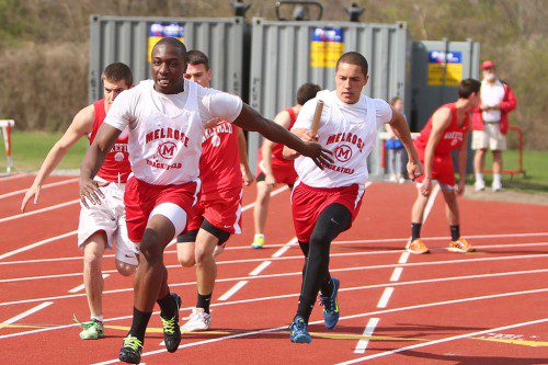 WILL CAFFEY (clutching baton) has been lights out for the Melrose boy's outdoor track team. (Donna Larsson photo) 