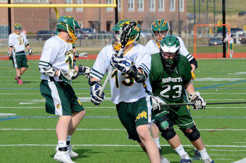 SOPHOMORE JACK SCHILLE (13), advances the ball against the "other" Hornets from Manchester–Essex. (John Friberg Photo)