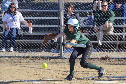 PERFECT BUNT. Hornet junior Carly Swartz lays down a perfect bunt in the first inning of North Reading’s softball season opener. (John Friberg Photo)