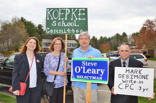 TUESDAY'S LOW VOTER TURNOUT did not discourage candidates on the ballot from putting in time at the polls to encourage voters. It's entirely possible when this photo was taken that the candidates outnumbered voters. From left: Selectman candidate Kathryn Manupelli, School Committee candidate Julie Koepke, Selectman Stephen O'Leary and CPC candidate Mark DeSimone. (Bob Turosz Photo)