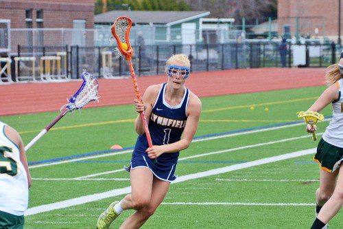 SENIOR CAPTAIN Bailey Fanikos (1) scored three goals during the girls’ lacrosse team’s 9-6 victory over North Reading on Friday, May 1.  (John Friberg Photo)