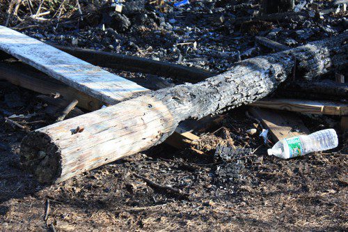 THE CHARRED remains of a wooden post that supported the observation tower overlooking Reedy Meadow is a visual reminder of the intensity of the May 6 brush fire that destroyed 65 acres of marsh. Fire officials suspect the five-alarm blaze originated at the tower, which provided exceptional views of the 540-acre marshland and the rare migratory birds that nest there. (Maureen Doherty Photo)
