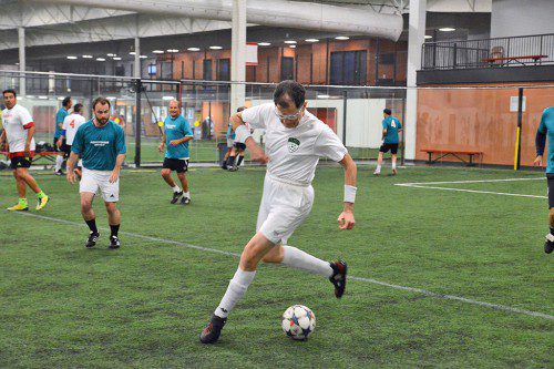 FANCY footwork is demonstrated by Boston Braves F.C. President Spiros Tourkakis of Lynnfield. He and his teammates were honing their skills at a recent practice in anticipation of the senior soccer club hosting the veterans of the European Champion F.C. Barcelona team at LHS Thursday at 6 p.m. (Courtesy Photo)